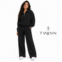 ترينج TWYNN نصف سوستة وبنطلون واسع — أسود